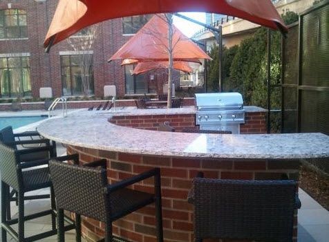 Outdoor grills by swimming pool