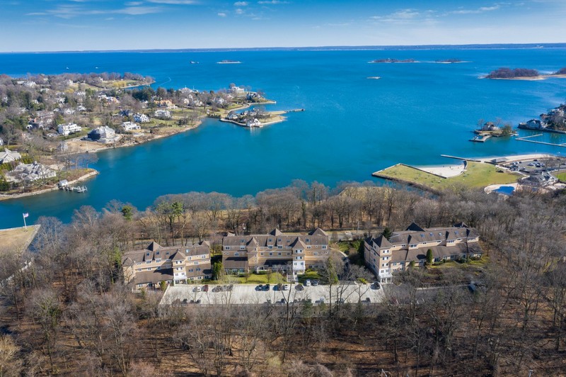 Aerial view of property with water view of long island sound
