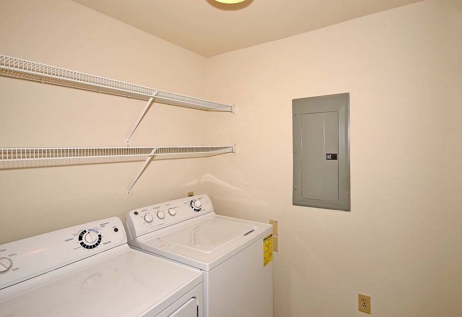 Apartment laundry room with washer and dryer