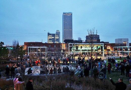Guthrie Green at dusk with Downtown views