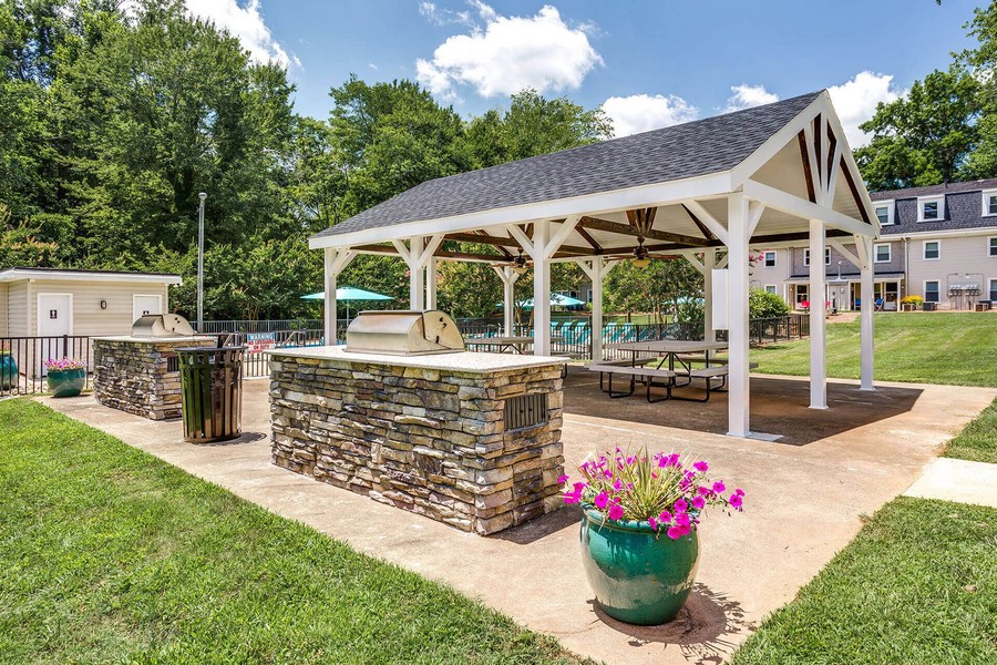 Outdoor picnic area with grills and seating